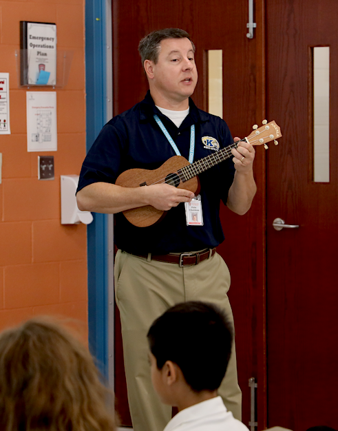 Mr. Cibulskas plays ukulele for students